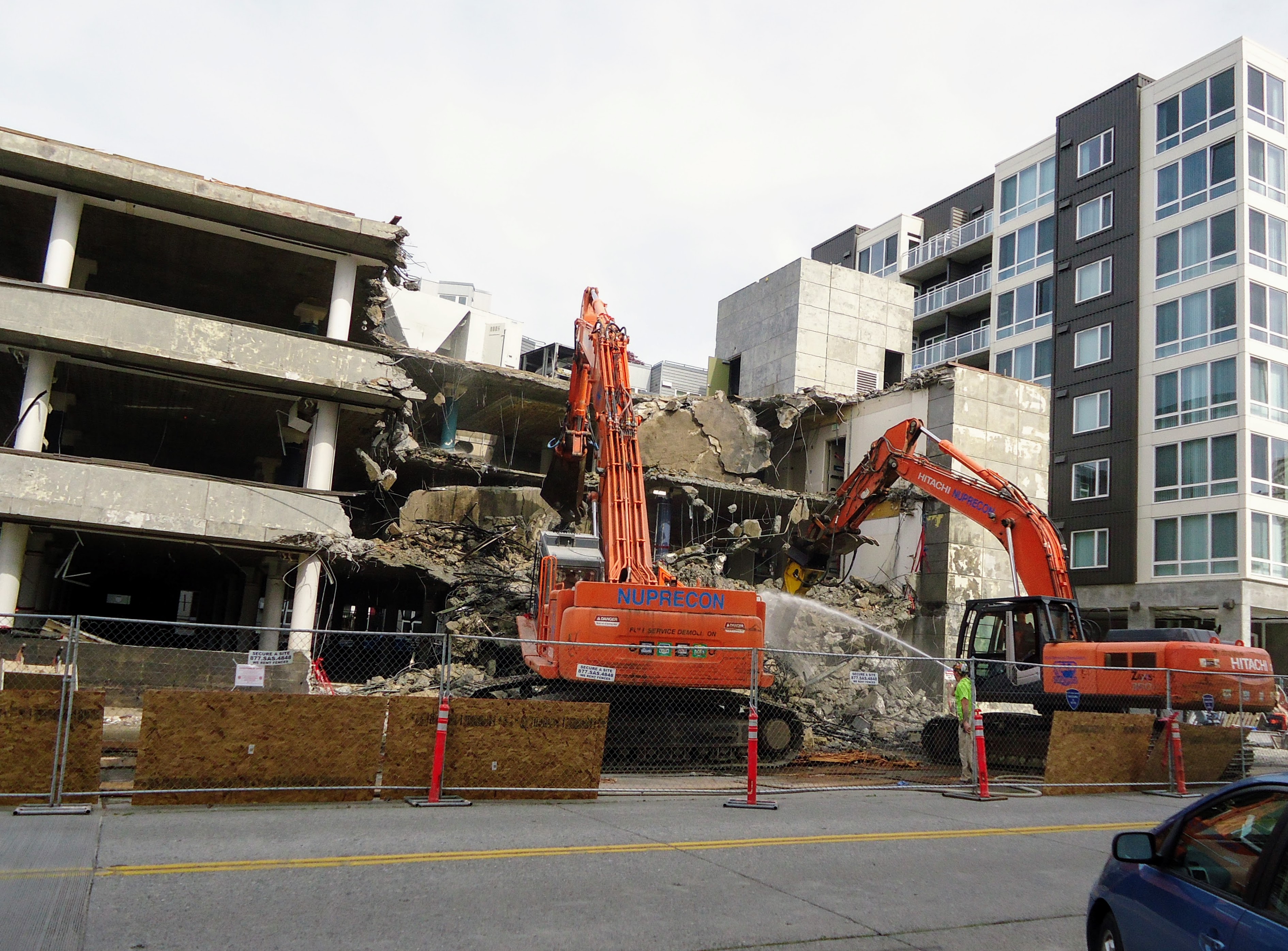 Excavator tearing down a structure